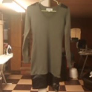 Green fitted dress with faux leather trimming